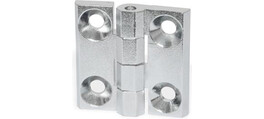 Nahaufnahme eines silbernen Metallscharniers mit vier Schraubenlöchern.