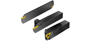Drei schwarze Drehwerkzeuge mit gelben Schneideinsätzen auf weißem Hintergrund.